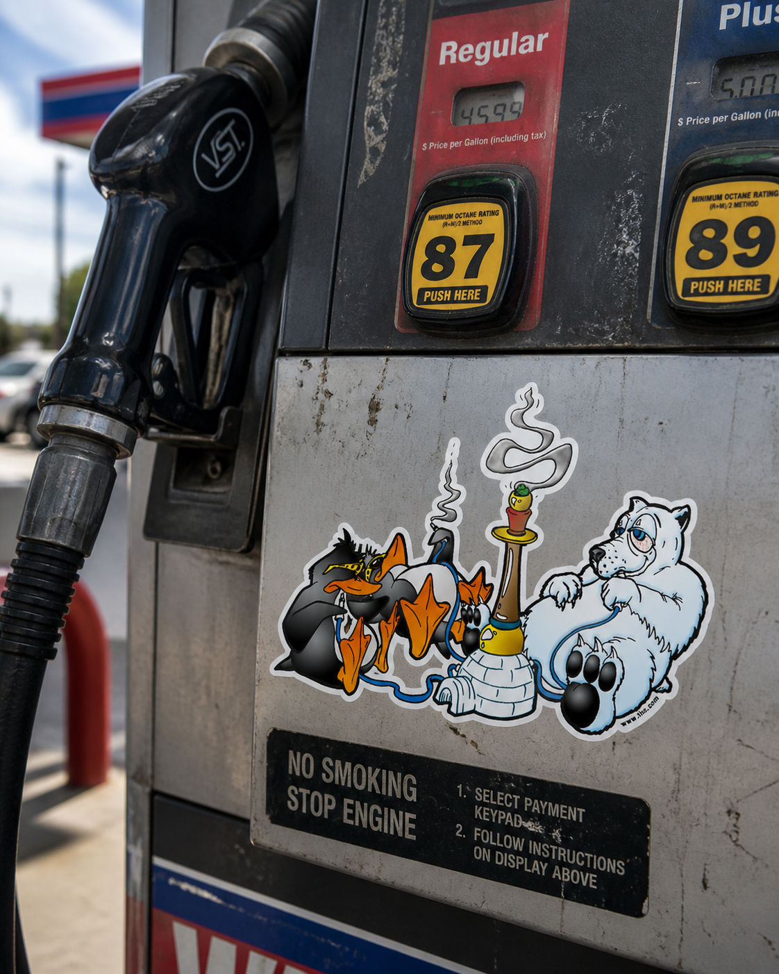 THC North Pole sticker on scratched gas station pump with fuel nozzle and weathered metal texture outdoors