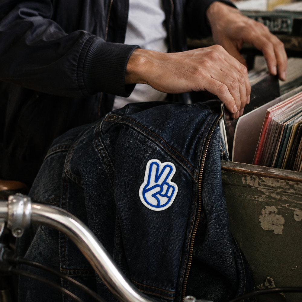 Fun Peace Hand Sign Patch shown in a street-style lifestyle setting