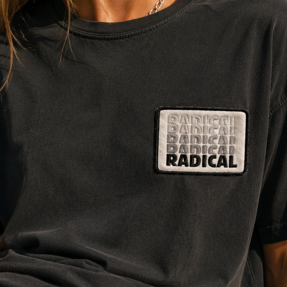 Fun Radical Patch on a black T-shirt in a retro skate-inspired streetwear setting