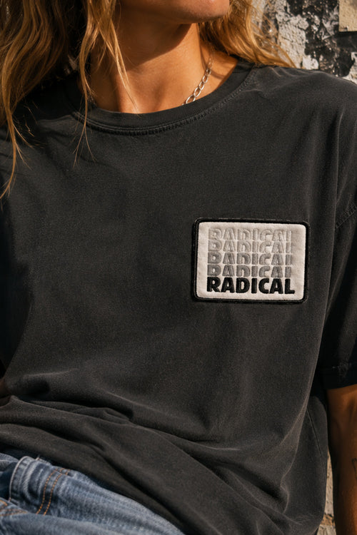 Fun Radical Patch on a black T-shirt in a retro skate-inspired streetwear setting