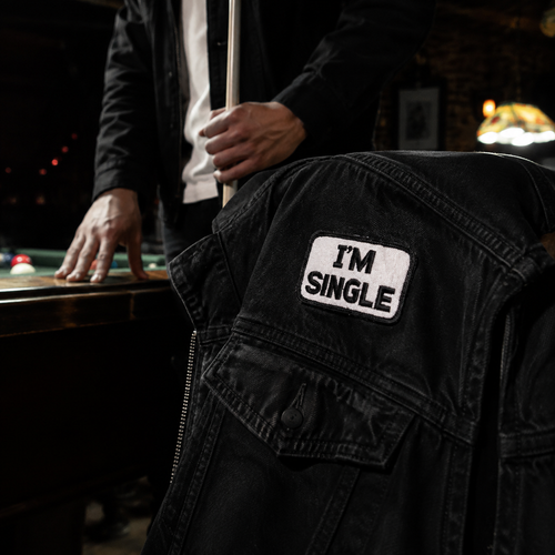 Fun I'm Single Patch shown in a street-style lifestyle setting