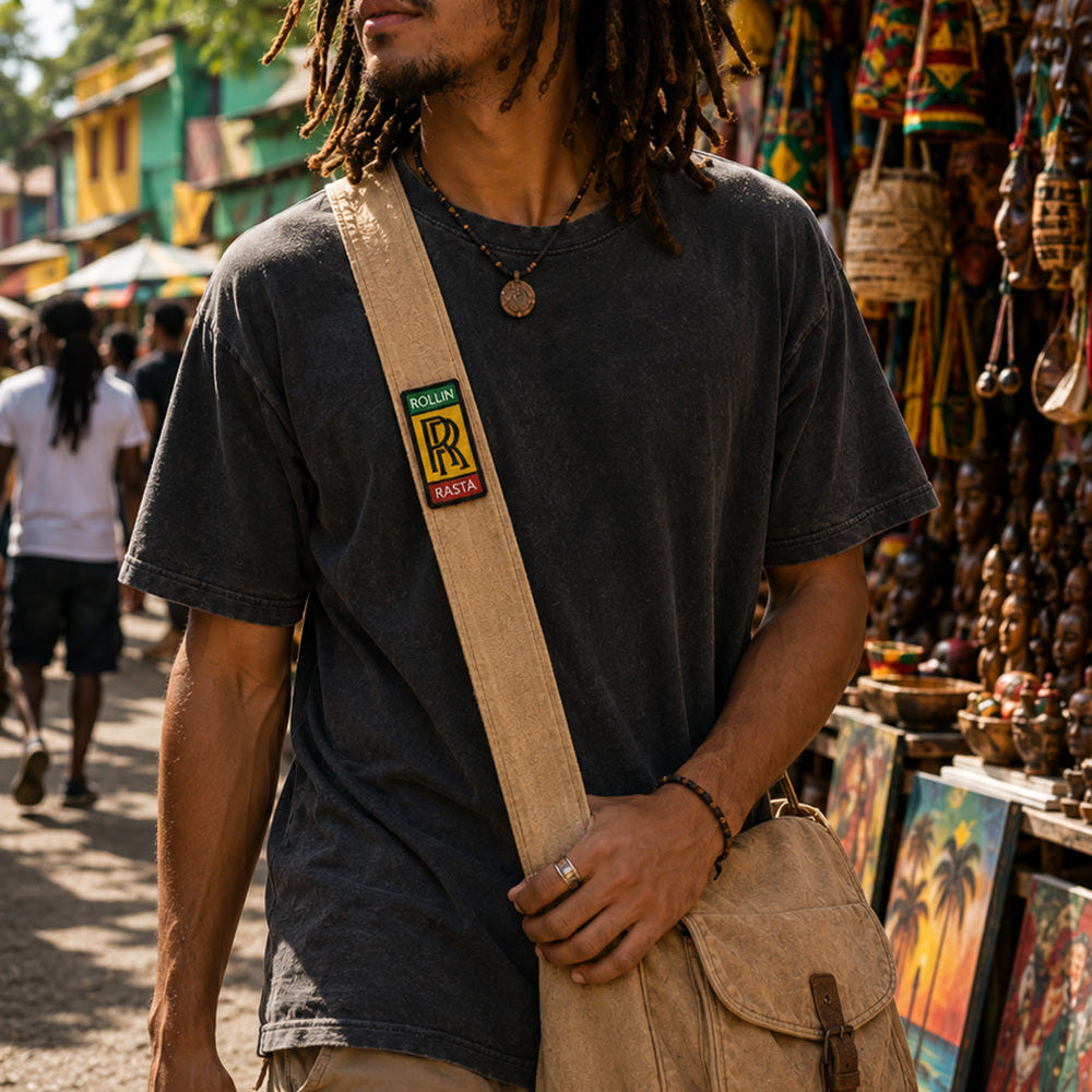 THC Rollin Rasta Patch displayed vertically on the strap of a natural tan canvas crossbody satchel worn by a young musician at an outdoor street market, featuring a reggae-inspired embroidered design