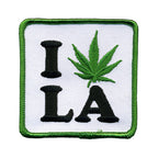 THC Leaf LA Patch featuring an embroidered “I LA” design with a green cannabis leaf replacing the heart on a white background with a green stitched border