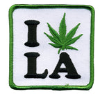 THC Leaf LA Patch featuring an embroidered “I LA” design with a green cannabis leaf replacing the heart on a white background with a green stitched border