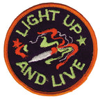 THC Light Up Patch featuring an embroidered smoking joint with swirling smoke and green lettering on a black circular background