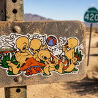 THC Alien Posse sticker placed on dusty metal road sign in desert landscape with sun and sand backdrop