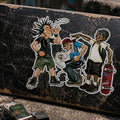 THC After School sticker placed on scratched skateboard deck with worn grip tape and street pavement background