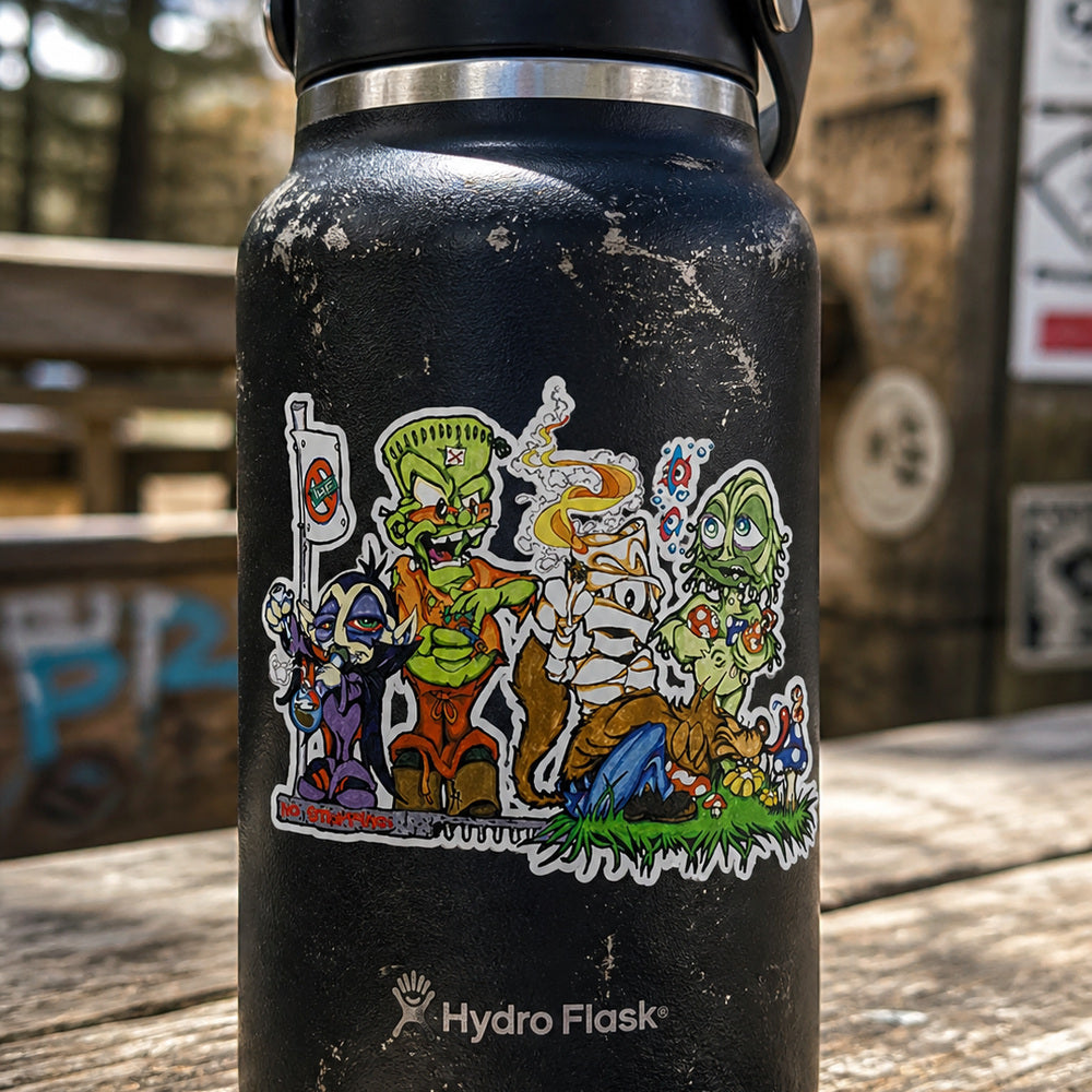 THC Monsters sticker displayed on scratched metal utility box covered in layered street art and graffiti