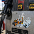 THC North Pole sticker on scratched gas station pump with fuel nozzle and weathered metal texture outdoors