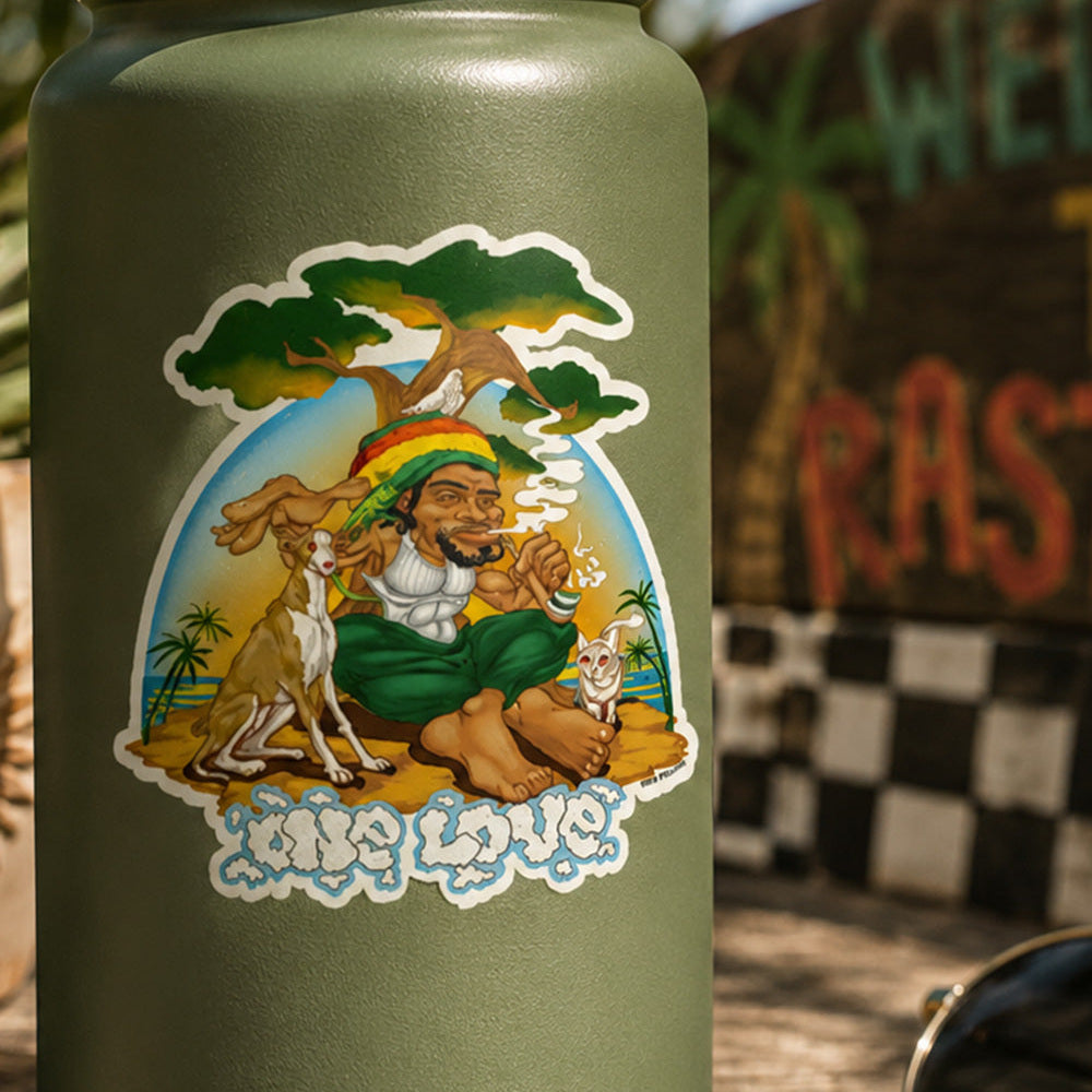 THC Rastaland Sticker on a green water bottle in a tropical outdoor setting