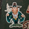 THC Uncle Sam sticker on worn guitar case with vintage Americana roadside backdrop