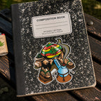 THC Rasta Joe sticker on black composition notebook on worn wooden park bench in outdoor setting